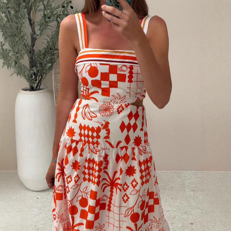 A model wearing a floral print colorblock strapless long dress with a one-shoulder design.