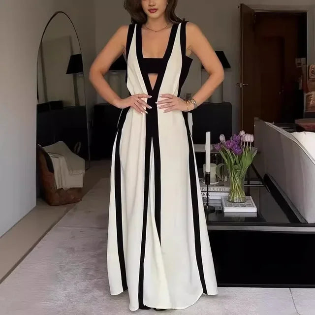 A backless A-line maxi dress in a black and white contrast color, with a V-neck.