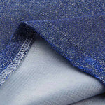 Close-up of blue glittery fabric with a textured surface