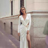 White or black long dress with metal cross-lace, halter neck, and V-neck.