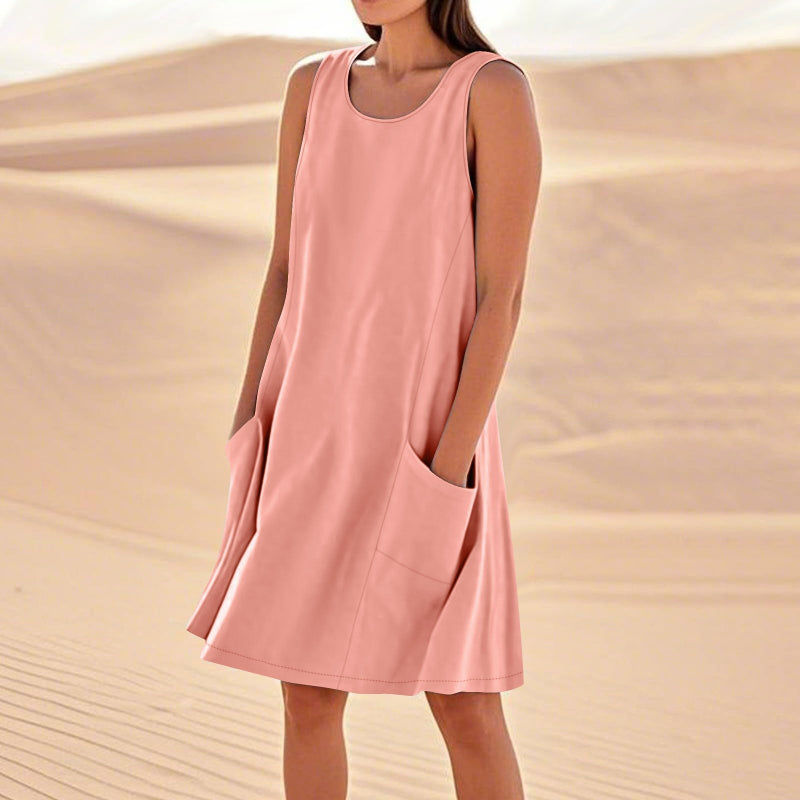 A sleeveless, mid-length A-line tank dress with a round neck.