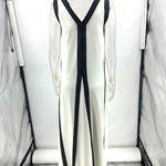 A backless A-line maxi dress in a black and white contrast color, with a V-neck.