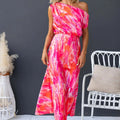 Model wearing a light blue split sleeveless printed midi dress with elegant flair in outdoor setting