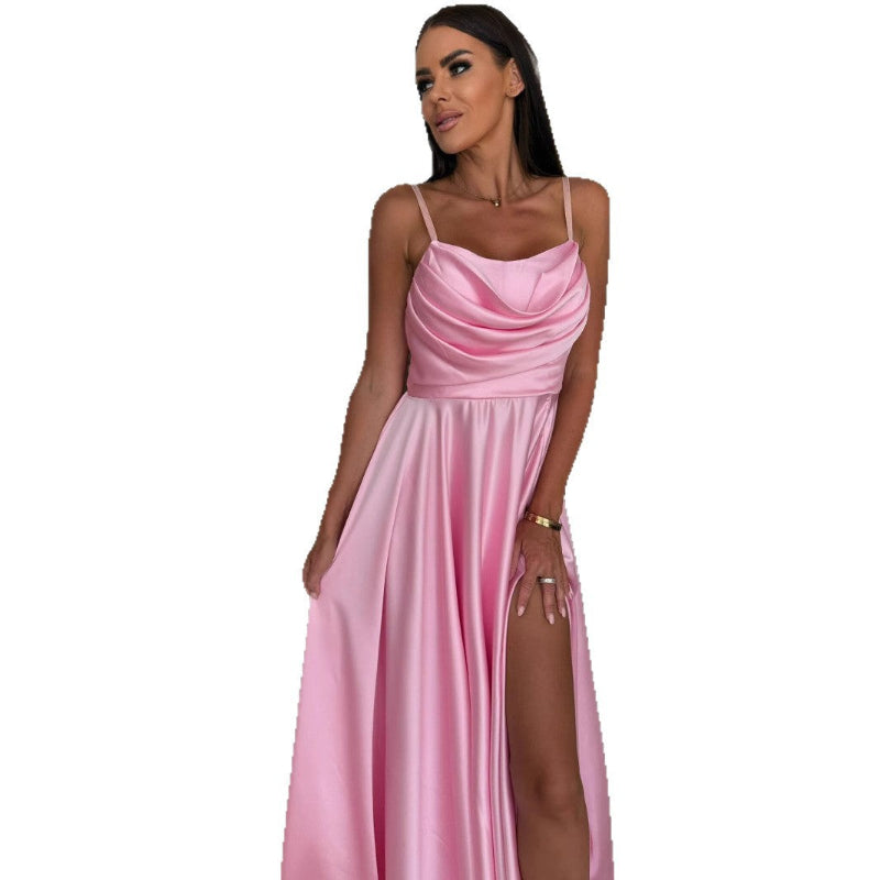 A black pleated strapless A-line midi dress with a side slit, displayed on a mannequin, highlighting its elegant design and flow.