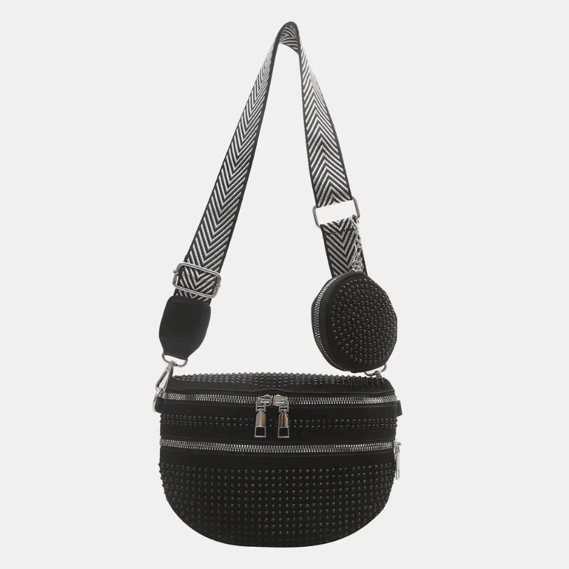 A medium-sized black crossbody bag made of PU material, adorned with metallic studs and featuring an adjustable strap.