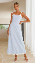 A light blue, slimming midi dress with a one-shoulder neckline and delicate lace straps, shown on a model.