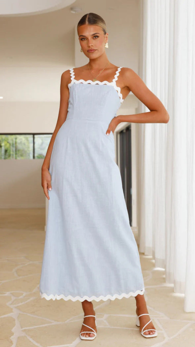 A light blue, slimming midi dress with a one-shoulder neckline and delicate lace straps, shown on a model.