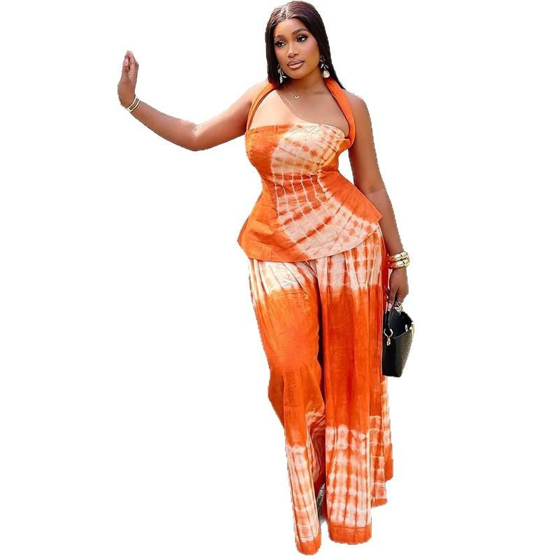 Backless printed long dress set with a halter neckline, a two-piece set for women, available in orange and navy blue.
