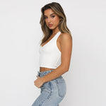 A white slim-fit sleeveless halter top displayed on a mannequin, showcasing its solid color and street fashion style.