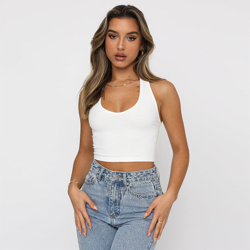 A white slim-fit sleeveless halter top displayed on a mannequin, showcasing its solid color and street fashion style.