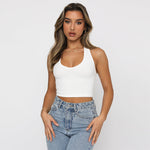 A white slim-fit sleeveless halter top displayed on a mannequin, showcasing its solid color and street fashion style.