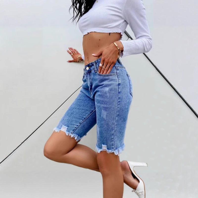 Stand out with these daring cropped jeans featuring bold rips and a rugged cowboy edge. Perfect for a fearless, fashion-forward look.