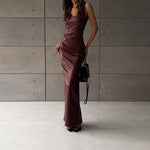 Black or wine red PU leather split long dress with a U-shaped collar, sleeveless design, high waist, backless feature, and one-step skirt, available in sizes S, M, L.