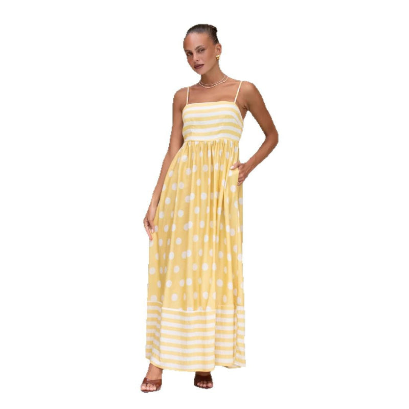 A sleeveless, high-waisted, midi-length dress with a printed pattern and a one-shoulder, backless design, photographed on a white background.
