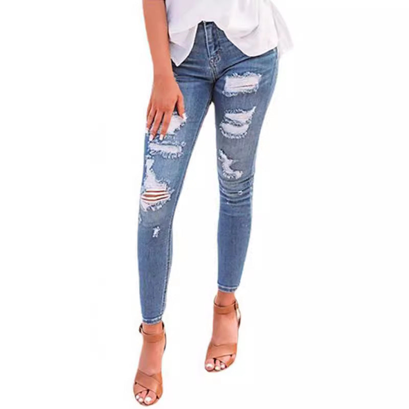 These high-waisted ripped elastic jeans combine edgy style with a comfortable, flexible fit for a bold, confident look.