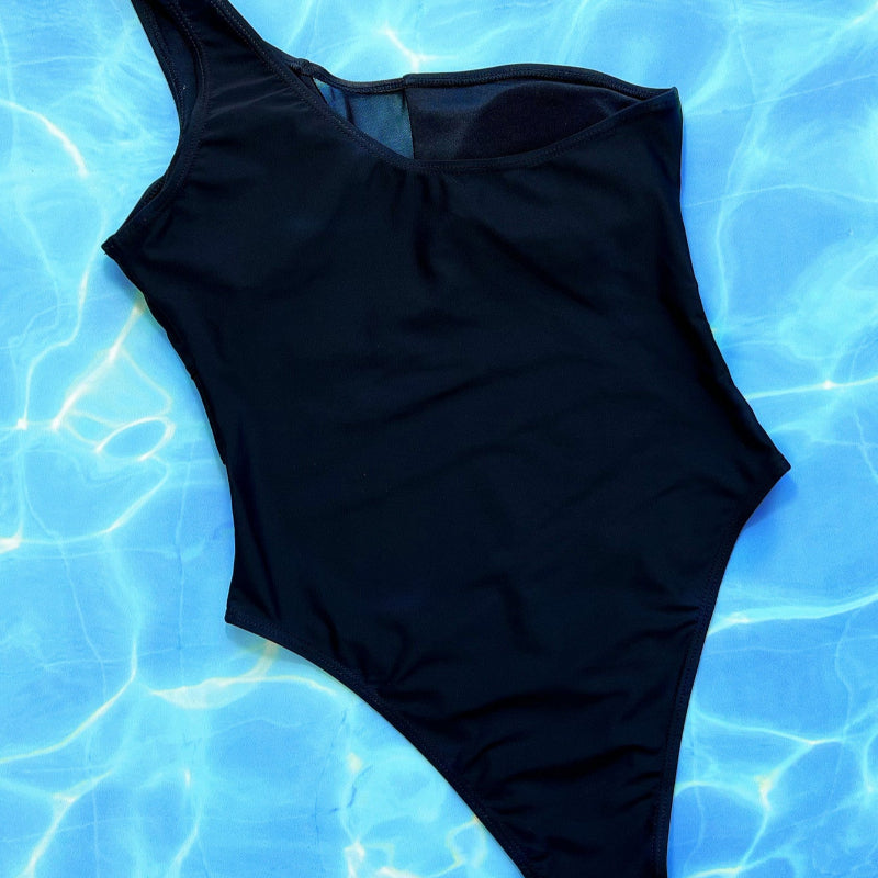 Make a bold statement with this daring mesh one-piece swimsuit, perfect for turning heads and feeling confident.