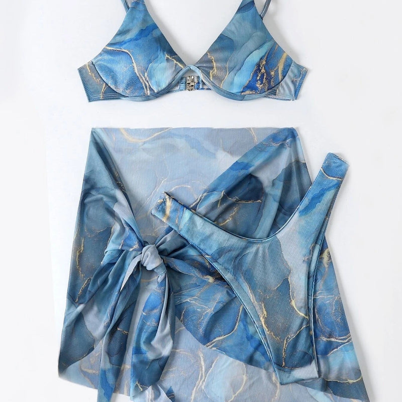 Blue marbled bikini set with matching cover-up on a white background