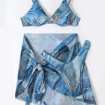 Blue marbled bikini set with matching cover-up on a white background