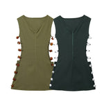 An elegant, sleeveless linen dress in a solid color with a stylish waist cut-out and a round neck.