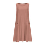 A sleeveless, mid-length A-line tank dress with a round neck.