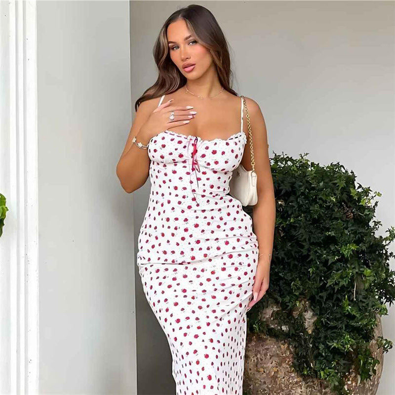 A pink floral print one-shoulder dress with a lace hem, displayed on a mannequin to showcase its long, fitted shape and sweet style.