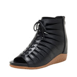 A pair of black high-top Roman sandals with a fish mouth toe style and lace-up closure.