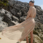 A long sleeve, solid-colored beach dress in a flowing, relaxed fit.