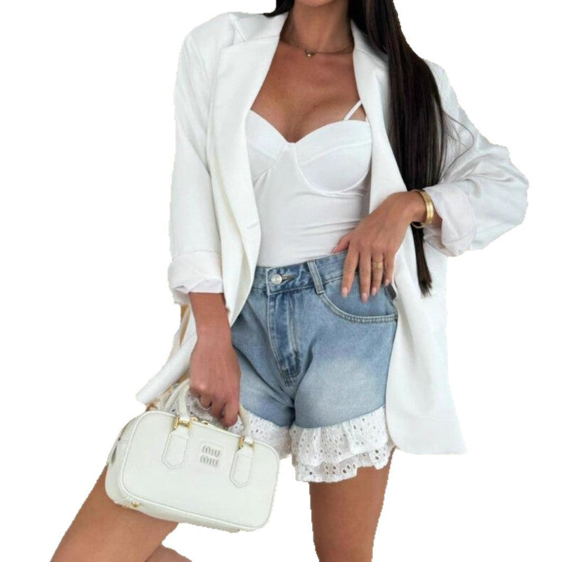 Blue denim shorts with a loose fit, mid-waist, and white lace splicing details on the hem, suitable for business casual wear.