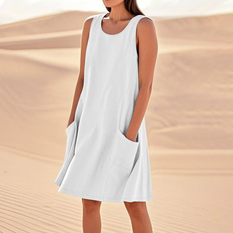 A sleeveless, mid-length A-line tank dress with a round neck.