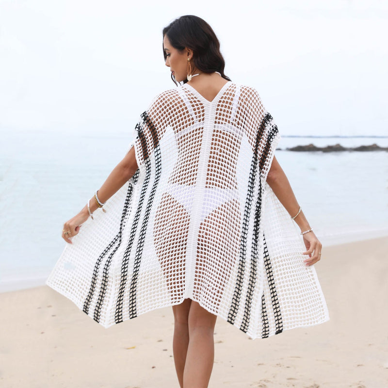 This crochet hollow bikini cover-up adds a bold, edgy touch to your beach look while letting your swimsuit peek through effortlessly.