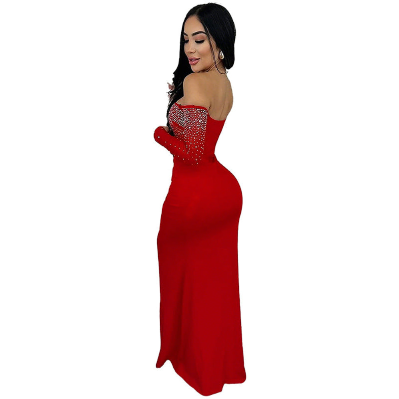 A red strapless midi dress with a high slit and rhinestone embellishments, designed for elegant office wear.