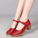 A pair of hollow sandals with a buckle closure, round toe, and low heel, showcasing the casual style and comfortable design.
