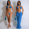 A model wearing a blue backless string halter bikini set.