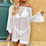 This daring three-quarter sleeve cover-up features bold hollow-out details for a striking look that layers effortlessly over your outfit.