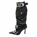 Step out boldly with these pointed toe, knee-length boots featuring a long tube design and a striking belt buckle detail.