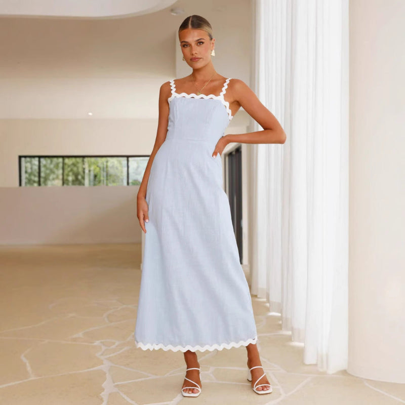 A light blue, slimming midi dress with a one-shoulder neckline and delicate lace straps, shown on a model.