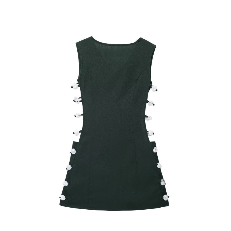 An elegant, sleeveless linen dress in a solid color with a stylish waist cut-out and a round neck.