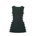 An elegant, sleeveless linen dress in a solid color with a stylish waist cut-out and a round neck.