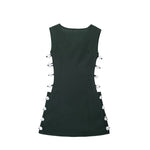 An elegant, sleeveless linen dress in a solid color with a stylish waist cut-out and a round neck.
