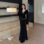 The Black V-Neck Midi: Beading, Boldness & Glamour