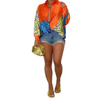 A loose-fit, long-sleeve shirt with a striking animal print pattern.