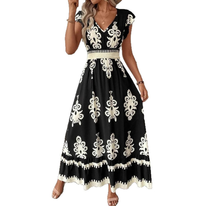 A stylish model wearing an elegant floral V-neck midi dress in a dark blue color. The dress has a waist-cinched design and a beautiful positional flower pattern, perfect for an elegant commuting style.