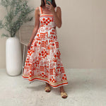 A model wearing a floral print colorblock strapless long dress with a one-shoulder design.