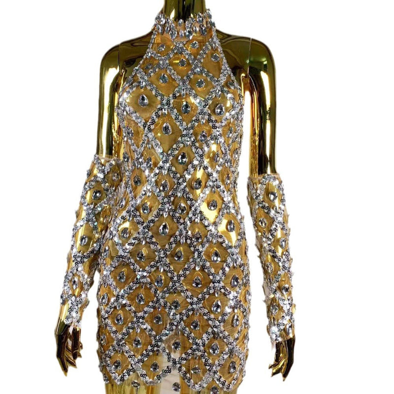 Gold and silver dress on a mannequin with a white background