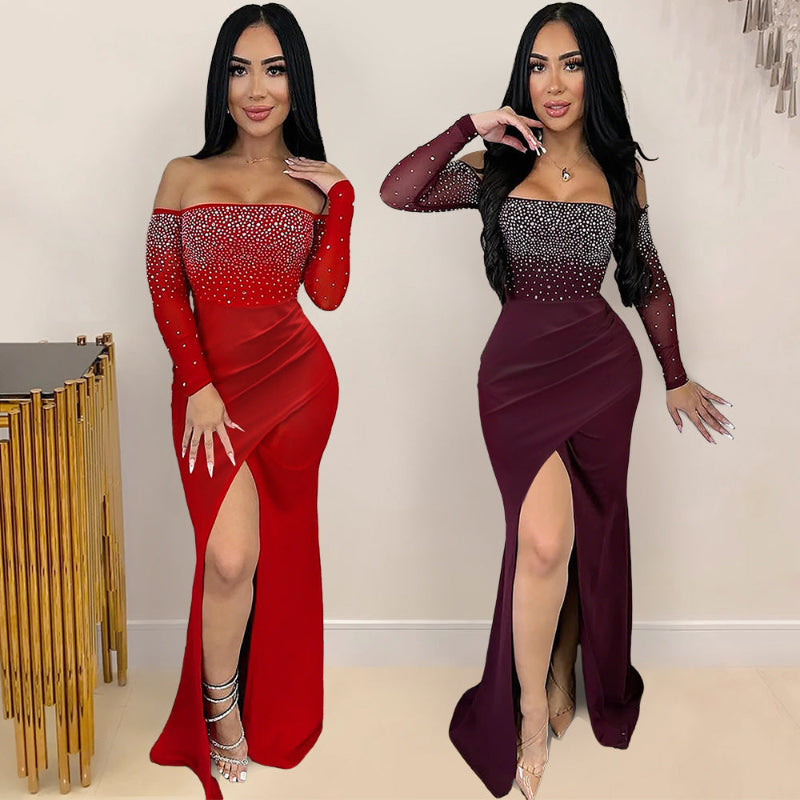 A red strapless midi dress with a high slit and rhinestone embellishments, designed for elegant office wear.