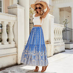 A woman wearing a vibrant, red, flared hem midi skirt with a high waist and pleated details.