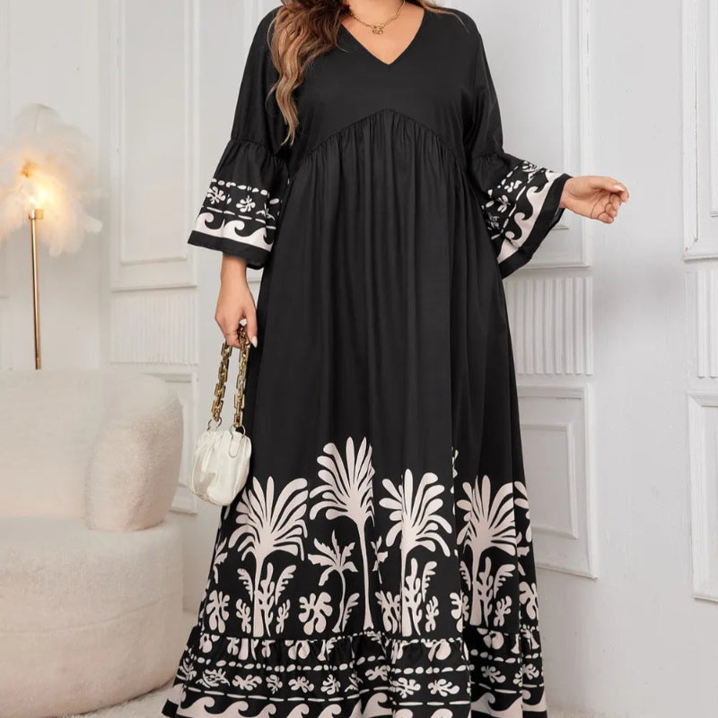 Honey Plus Size Printed V-Neck Long Sleeve Maxi Dress. Elegant V-neck, all-over print, long sleeves, comfortable stretch fabric.