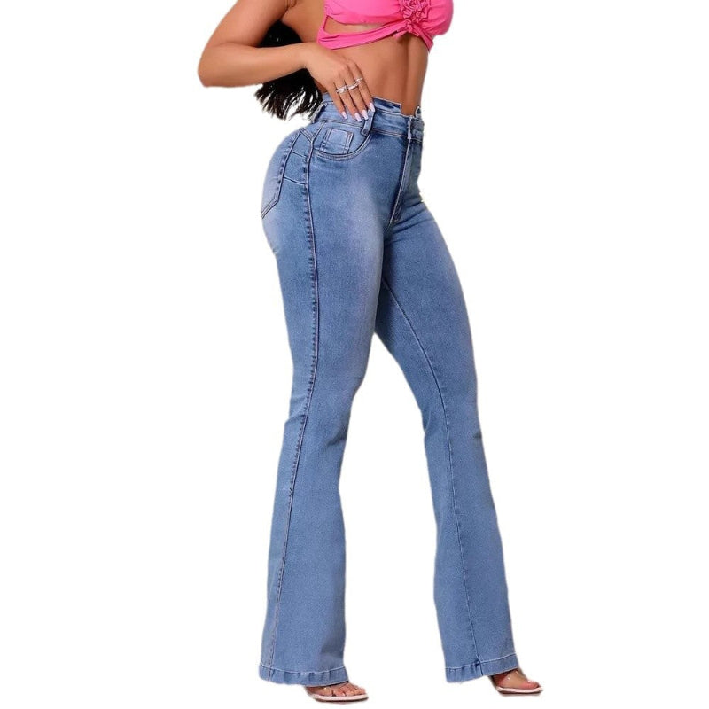 A model wearing slim fit, high-waisted, faded blue flared jeans with patchwork details.