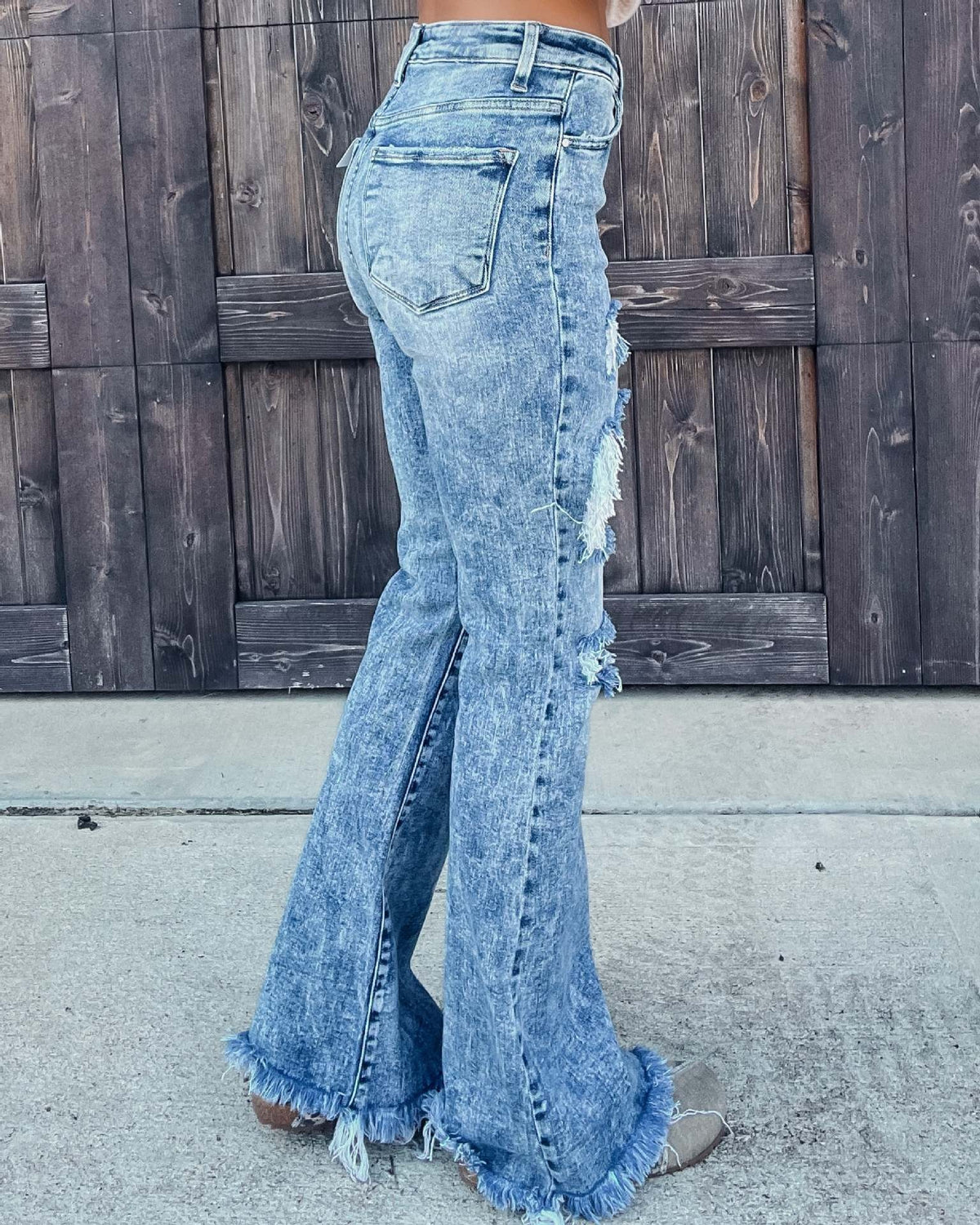 Distressed water washed micro flared jeans - runwayfashionista.com