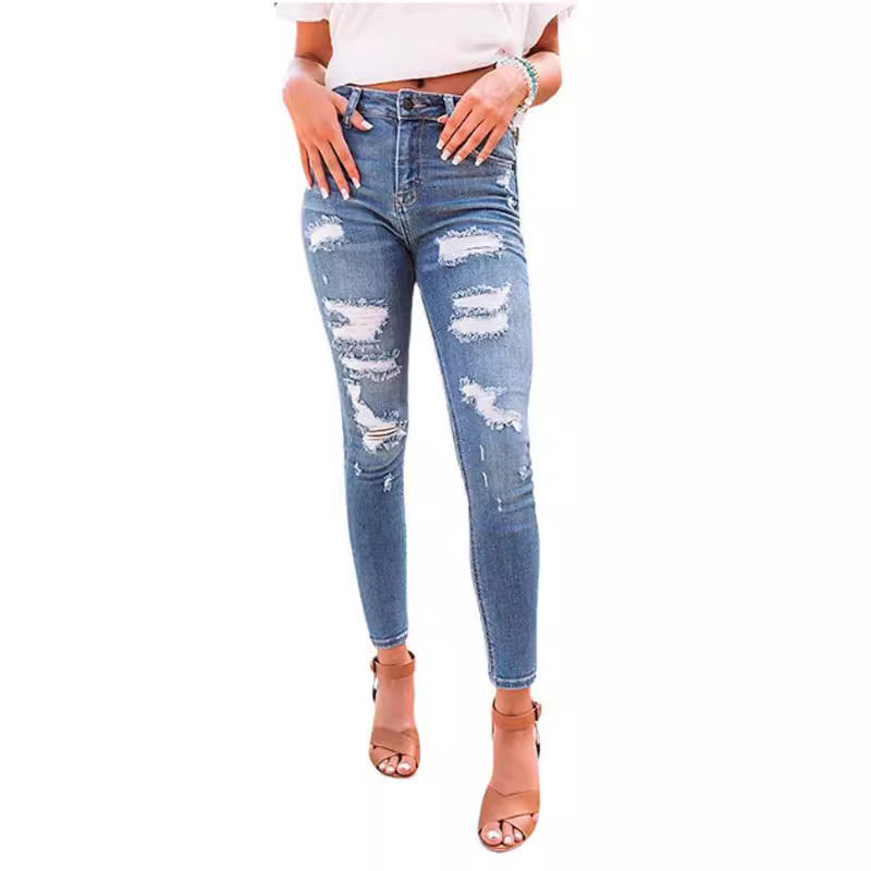 These high-waisted ripped elastic jeans combine edgy style with a comfortable, flexible fit for a bold, confident look.